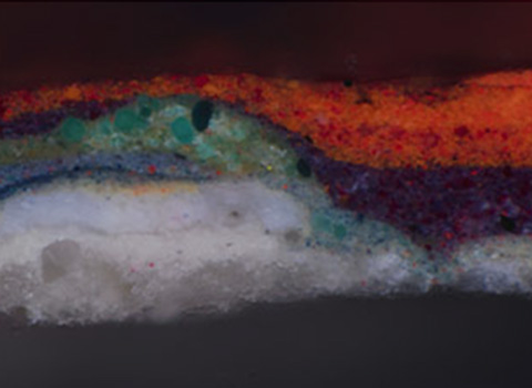 Microscopic image of a cross-section of oil paint layers from a painting