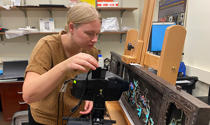 Meier sets up X-ray fluorescence (XRF) spectroscopy scan to study pigment used to enhance designs.