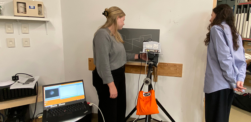Post-doctoral fellows Madeline Meier and Hortense de La Codre set up Fourier transform infrared analysis (FTIR).