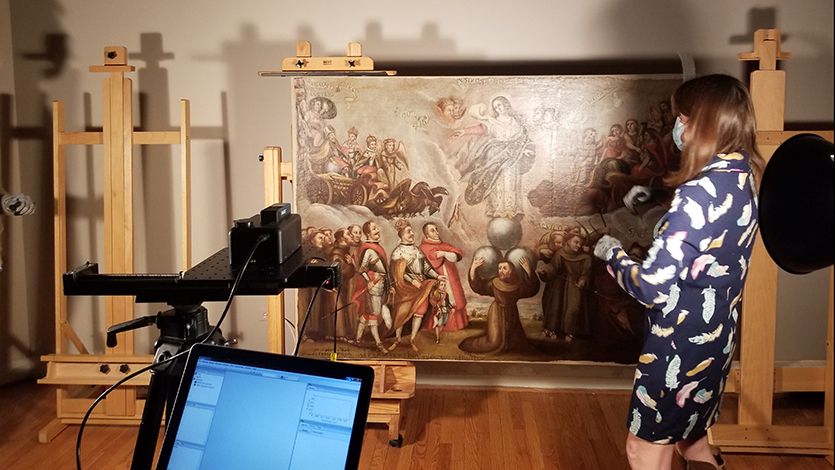 Center postdoctoral fellow Marc Vermeulen and NMMA curator Rebecca Meyer set up the scan for a 19th-century untitled painting that is often referred to as The King and His Conscience/Tree of Life.